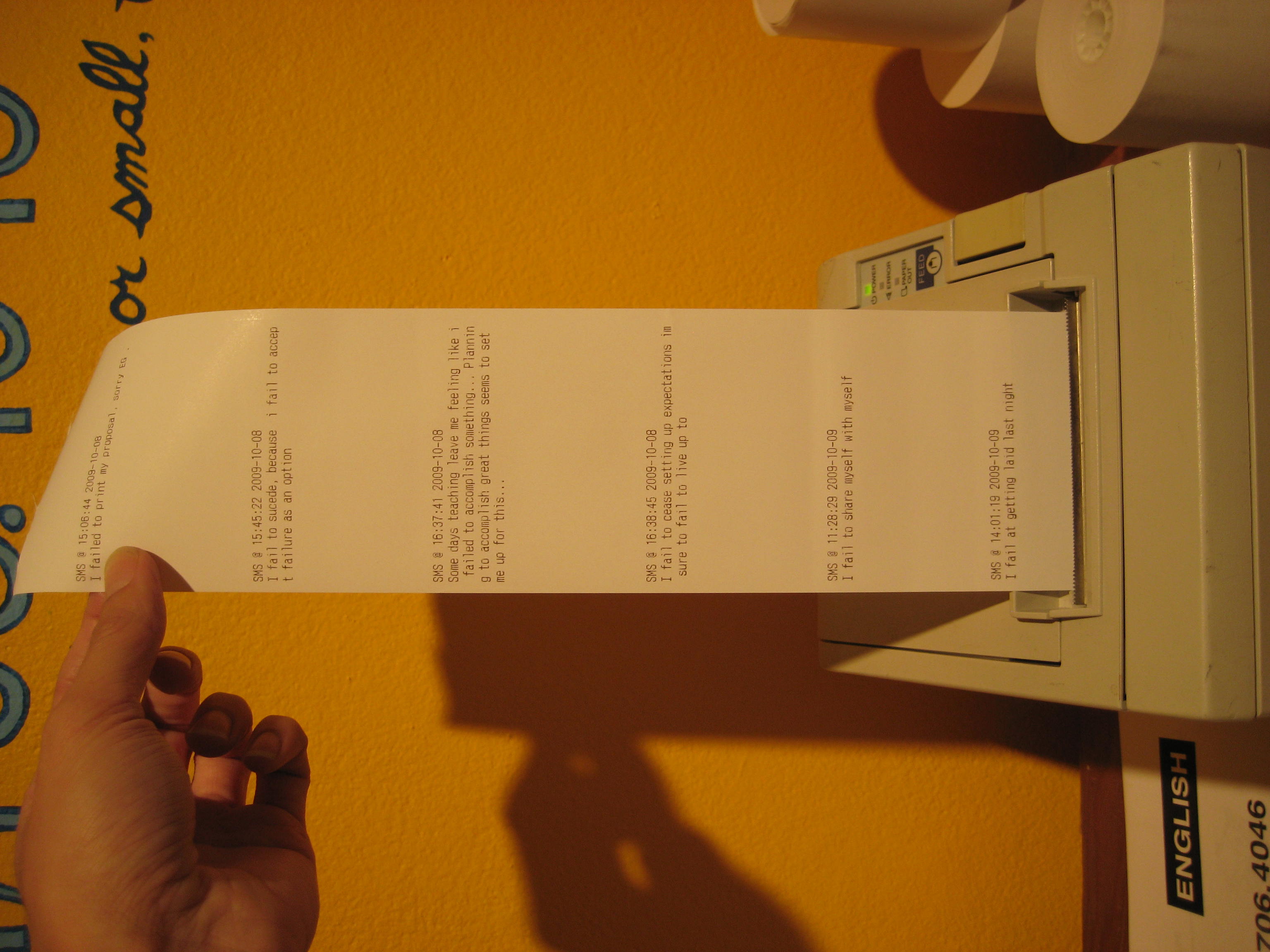 A close-up photograph of a printed failure receipt from the thermal printer.
