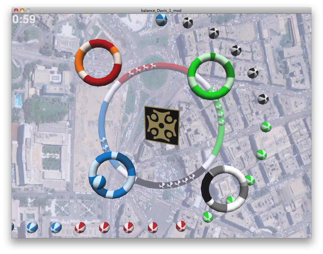 Screenshot of The Return of Balance game, showing four colored rings on a textured plane.