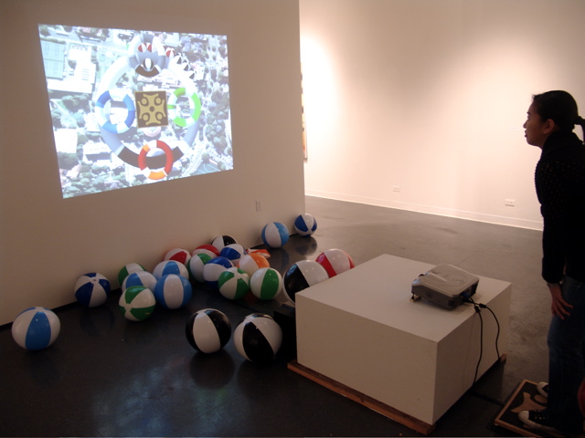 Photograph of The Return of Balance installation, with a person standing on the weight-sensing pad.